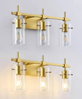 Gold Three Light Bathroom Vanity Fixture Set with clear globe shades, mounted on wall, supports various bulb types, modern design.