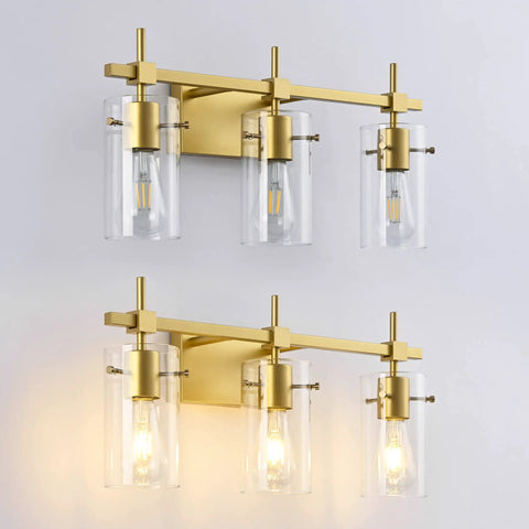 Gold Three Light Bathroom Vanity Fixture Set with clear globe shades, mounted on wall, supports various bulb types, modern design.