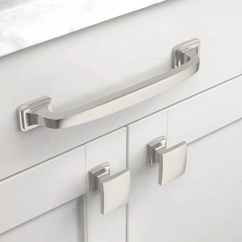 Close-up of 10 Pack 5 Inch Cabinet Handles In Brushed Satin Nickel on white kitchen cupboard, featuring 128mm hole centers