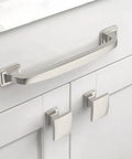 Close-up of cabinets with 20 Pack Zinc Kitchen Cabinet Knobs In Brushed Satin Nickel, and matching handle on white doors.