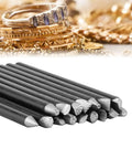 Jewelry Making Punch Stamp Kit With 16 Steel Punches And Anvil Chisel Metal Crafting Tools for pattern embossing next to gold rings.