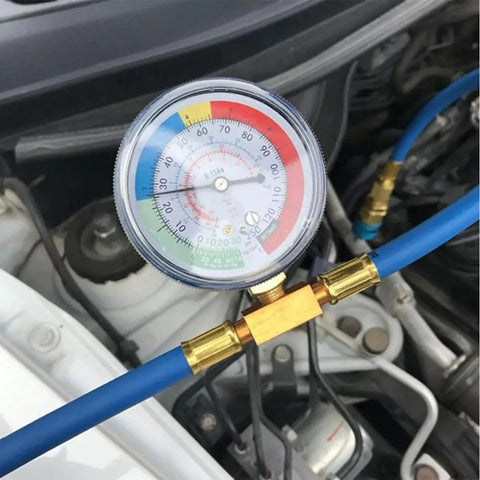 R134A Car Air Conditioning Refrigerant Charge Hose Kit with gauge attached for quick vehicle refrigerant recharge in engine bay