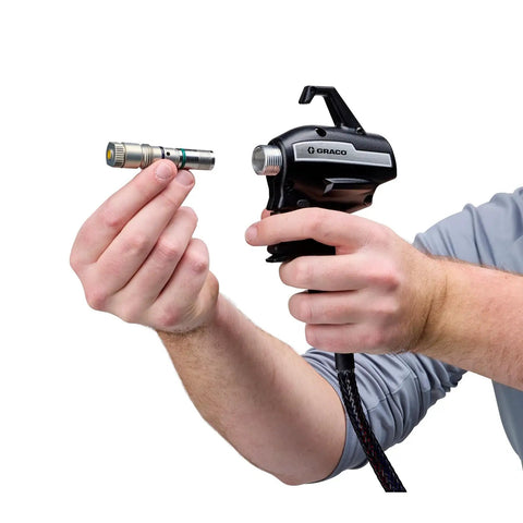 Person holding spray tip for Badass Cordless Airless Paint Sprayer With Instant Electric Trigger for home projects.