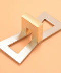 Top Tier Dovetail Marker And Joinery Guide With Dead Accurate Scale Marks, Sweet 1 To 8 Ratios For Effortless Hand Cut Wood Joints, Slick Silver Template side view on peach background.