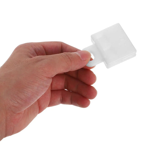Hand holding 30 Pack Car Window Regulator Mounting Brackets White Plastic Channel Clips For Automotive Glass With Anti Loosening Design