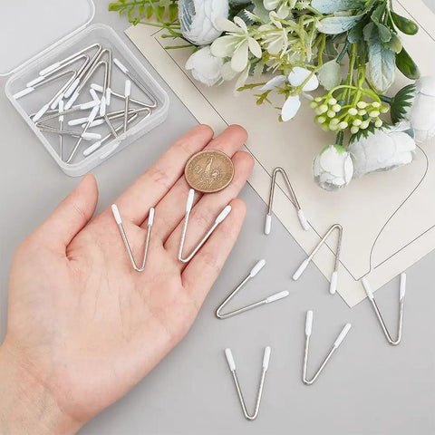 Hand holding 20 Piece V Shape Bra Wires Stainless Steel Underwire Replacement For Bras Corsets Dresses And Swimwear Durable Steel Wires