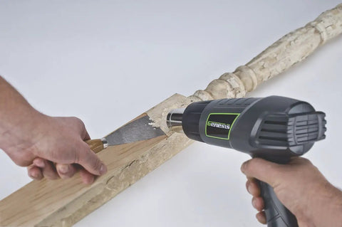 Using Genesis GHG1500A Dual Temperature Heat Gun Kit With Fast Heat Up To 1000F And 572F to remove paint from wood surface