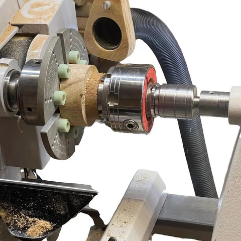 Beefed Up Live Tailstock Chuck Adapter For Wood Lathe Converts Dead Tailstock To Live With 1 Inch By 8 Tpi Thread Mount And Number Two Morse Taper Mount installed on a lathe.