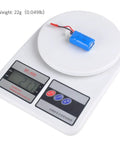 Ultra Compact 400mAh 2S 7.4V 30C LiPo Battery Pack With JST Plug on digital scale, weighing 22g for micro FPV racing drones