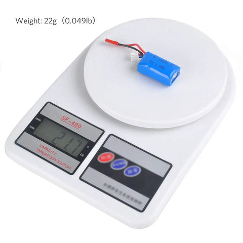 Ultra Compact 400mAh 2S 7.4V 30C LiPo Battery Pack With JST Plug on digital scale, weighing 22g for micro FPV racing drones
