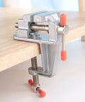 Go To Compact Mini Bench Vise For Jewelry Making And DIY Repairs Space Saving Metal Clamp With 36mm Opening Fits 34mm Table Thickness Handy Desk Clamp For Small Projects And Craftwork attached to desk