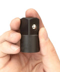 Close-up of a hand holding 1/2 Inch to 3/4 Inch Impact Drive Adapter for Impact Wrenches Converting 1/2 To 3/4 Inch, with Spring Loaded Detent Ball.