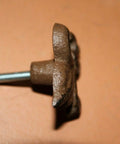 Side view of a cast iron Fleur De Lis knob from the French Victorian Cabinet Knobs Pack Of 60 for 2-inch cabinets.