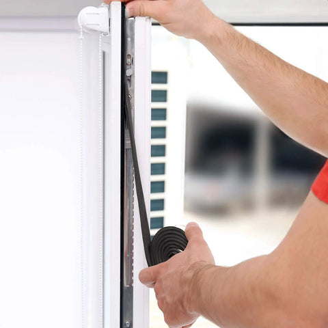 Person installing Neoprene Weather Stripping Roll 4 Inch Wide 10 Foot Long One Quarter Inch Thick With Self Adhesive Backing for windows.