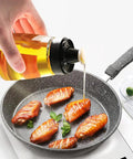 Leak-Proof Oil Dispenser Bottle For Outdoor Camping, 160 Ml And 5.4 Oz Glass Olive Oil And Vinegar Cruet With Well Sealed Silicone Cap, Go-To Picnic Kitchen Companion, No Spill Design, pouring oil into frying pan