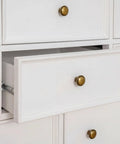 30 Pack Antique Brass Drawer Knobs 1-1/4 Inch, Solid Zinc Alloy Round Cabinet Knobs installed on white dresser