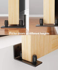 Black Floor Guide And Bottom Wall Guide Set For Barn Doors With Flush Design Flat Bottom Stay Roller installed on wood door