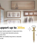 Heavy Duty Picture Hangers And Double Headed Wall Hooks With Bulletproof Grip Rating Up To 30 Lbs For Drywall Or Wood Studs Zero Hassle Setup Hang Gallery Walls Without Sweat Includes 30 Pack, close-up of wall screw.