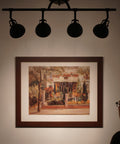 Silhouette view of Slick Broadway 30 Inch Modern Industrial 4 Light Fixed Track Lighting Kit with art in oil rubbed bronze.