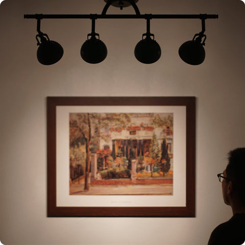 Silhouette view of Slick Broadway 30 Inch Modern Industrial 4 Light Fixed Track Lighting Kit with art in oil rubbed bronze.