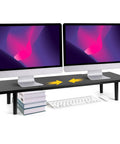 Dual Monitor Stand Riser For Desk With Adjustable Length 32 To 40 Inches in black, holding two monitors, keyboard underneath.