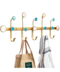 Heavy Hitter Wall Mounted Coat Hooks With Sleek Gold Iron Finish For Holding Coats Hats Keys And Jackets, featuring decorative turquoise accents.
