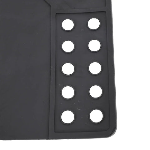 Corner of Magnetic Cleaning Mat With Magnetic Dots Non Slip Rubber Workbench Pad For Electronics Cars Motorcycles And Phone Repair Pro Grade Oil Proof Surface 16.5 X 10.4 Inches Black showing circular magnetic dots on edge.