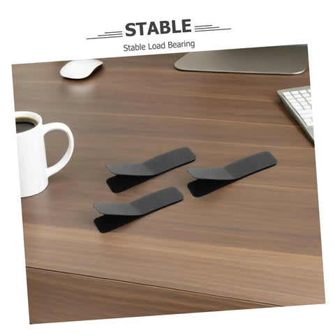 Super Strong Double Sided Hook And Loop Strips 100 Count Black Pet Film Fasteners With Sticky Back on a desk with a coffee cup.
