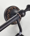 Close-up of a decorative base detail on Oil Rubbed Bronze Toilet Paper Holder With Cover, Brass Tissue Roll Holder for Bathroom.
