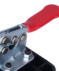 Close-up of 35mm hinge boring jig with red handle, steel clamp and ABS base.
