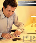 Man using Portable LED Table Lamp With 3-Level Brightness, Metal Desk Light With 3 Color Touch Control on desk