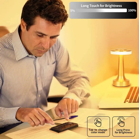 Man using Portable LED Table Lamp With 3-Level Brightness, Metal Desk Light With 3 Color Touch Control on desk