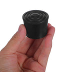 Round Rubber Chair Leg Caps 32mm Kit Non Slip Furniture Feet Pads With Noise Reduction held in hand