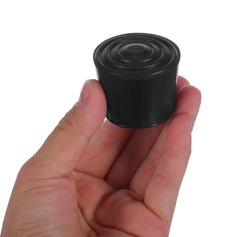 Round Rubber Chair Leg Caps 32mm Kit Non Slip Furniture Feet Pads With Noise Reduction held in hand