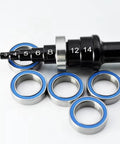 Steel Sealed Bearing 6700 2RS 10x15x4mm For 1/10 RC Cars Upgrade Part High Precision Metal Bearing Improves Transmission Efficiency And Power Transfer Durable Replacement Accessory For RC Car Enthusiasts, blue-sealed bearings displayed with a sizing tool