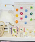 Dope Tsumami Craft Plate Kit display with folding and sword horn knobs, featuring flower decorations on a table setup