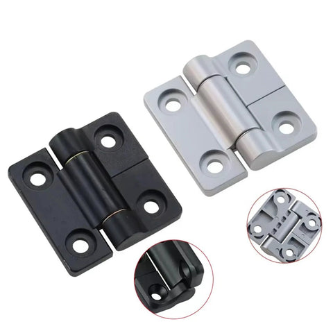 Angled view of two zinc alloy torque square damper hinges with random stop; matte black and silver finishes.
