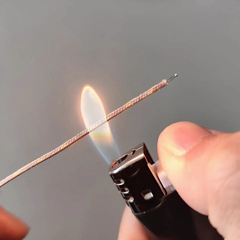 Close-up of K Type Mini-Connector Thermocouple Temperature Probe Sensor showing fiberglass insulation and flame test