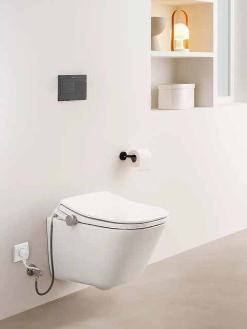 Next Level Bidet Toilet Seat Featuring Dual Warm Water Spray Plus Quick Air Dry Fan, sleek white finish mounted on wall.