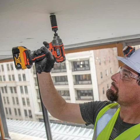 Construction worker using 2 In 1 Impact Socket Set With One Half Inch Drive, 5 Piece Deep Twelve Point Sockets on drill