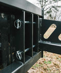 Close-up of Skid Steer Sod Roller With Adjustable 36in 44in 52in Widths, Universal Quick Tach mounting system outdoors.