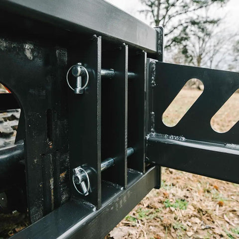 Close-up of Skid Steer Sod Roller With Adjustable 36in 44in 52in Widths, Universal Quick Tach mounting system outdoors.