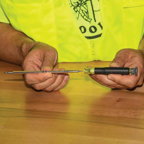 Person holding Pro Grade Precision Driver Kit With 39 Bit Multi Screwdriver And All In One Repair Tool For Apple Devices 2 Piece Set