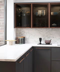 Modern kitchen with Six Pack 5.04 Inch Center To Center Antique Copper Drawer Pulls Red Bronze Bar Handles on dark cabinets.
