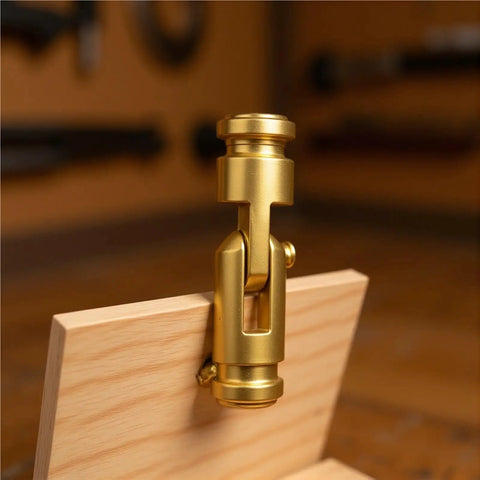 Close-up of brass hidden barrel hinge set for cabinets and furniture continuous piano cylindrical hinges on wood box