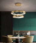 Modern K9 Crystal Chandelier, Dimmable LED Ceiling Pendant Light, Gold Circle Hanging Lamp above a dining table in a stylish kitchen.