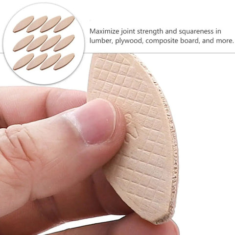 Hand holding a beech wood joining biscuit from a 100 Piece Pack Beech Wood Joining Biscuits Deliver Rock Solid Bonds When Gluing Wooden Boards Together While Making Carpentry Work Dead Simple With Every Biscuit Joiner.