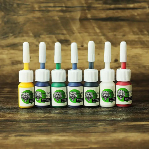 Seven tattoo ink bottles included in Dual Rotary Tattoo Machine Kit For Beginners with Power Supply And Foot Pedal One Liner