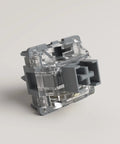 Close-up of Silver Pro V3 5 Pin Linear Keyboard Switch with Dustproof Stem, Pre Lubed for Gaming, Alloy Copper and Palladium Gold Contacts
