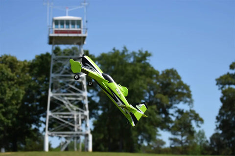 Remote Control Airplane For Grownups MXS V2 1100mm Wingspan 3D aerobatic flying near a tower outdoors